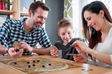 family playing a travel board game