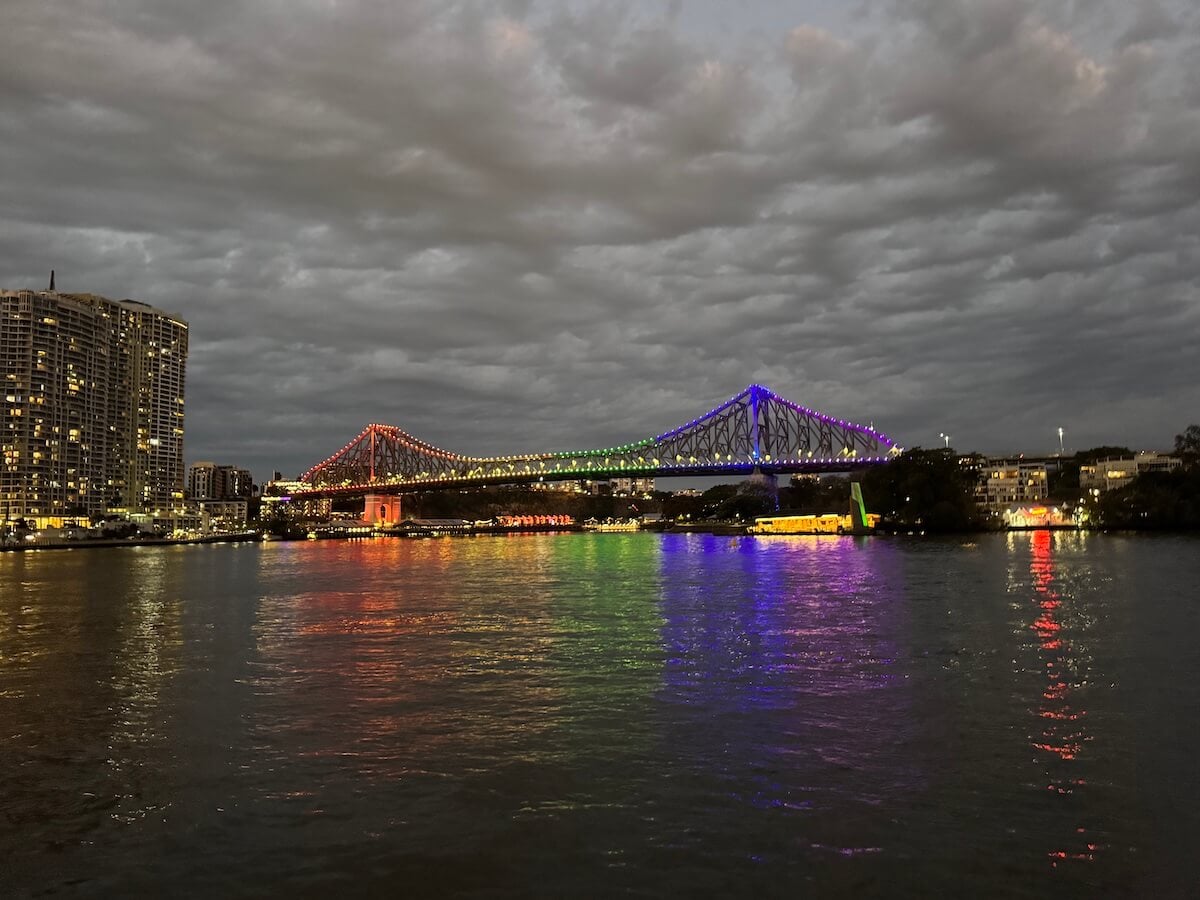 brisbane story bridge lit up at night.