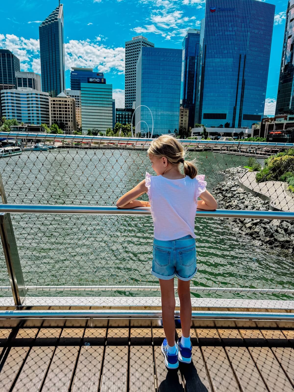 child looking over elizabeth quay perth.