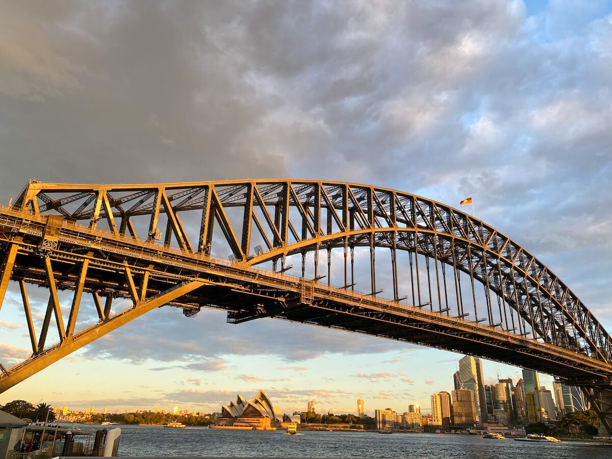 view of the Sydney Harbour bridge just before sunset from the water