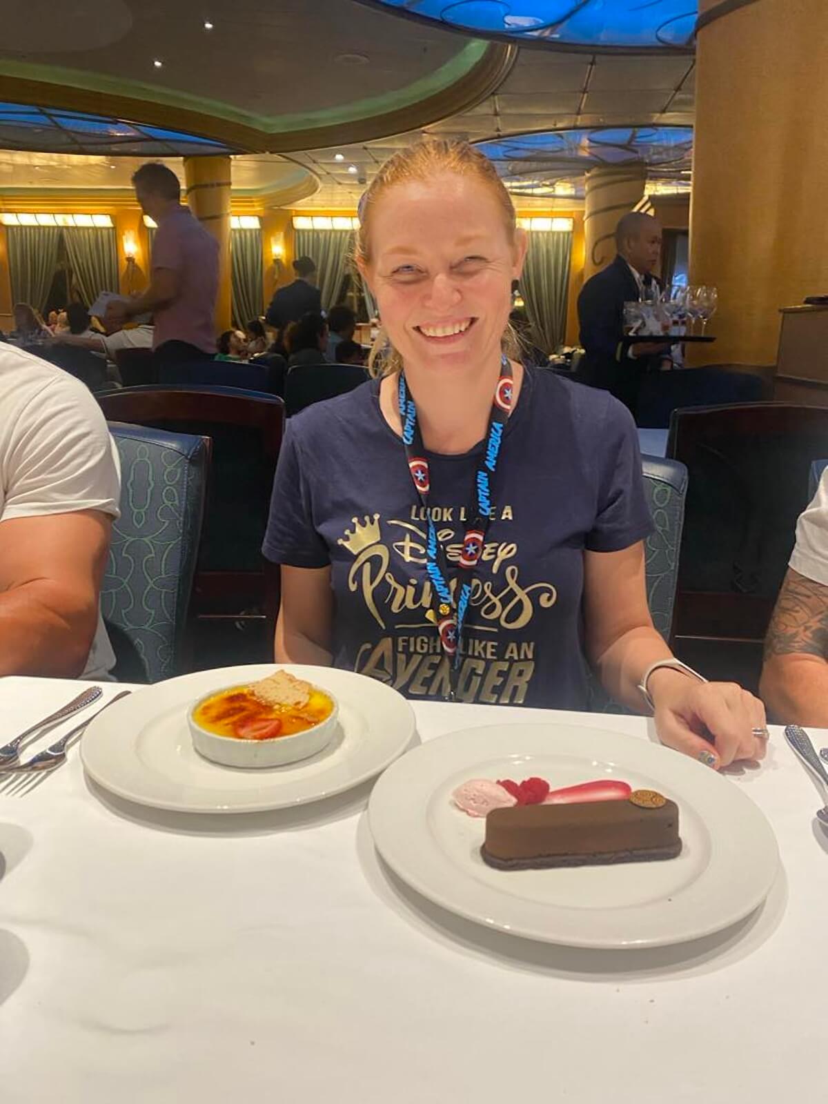holly with two desserts at tritons restaurant on the disney wonder.
