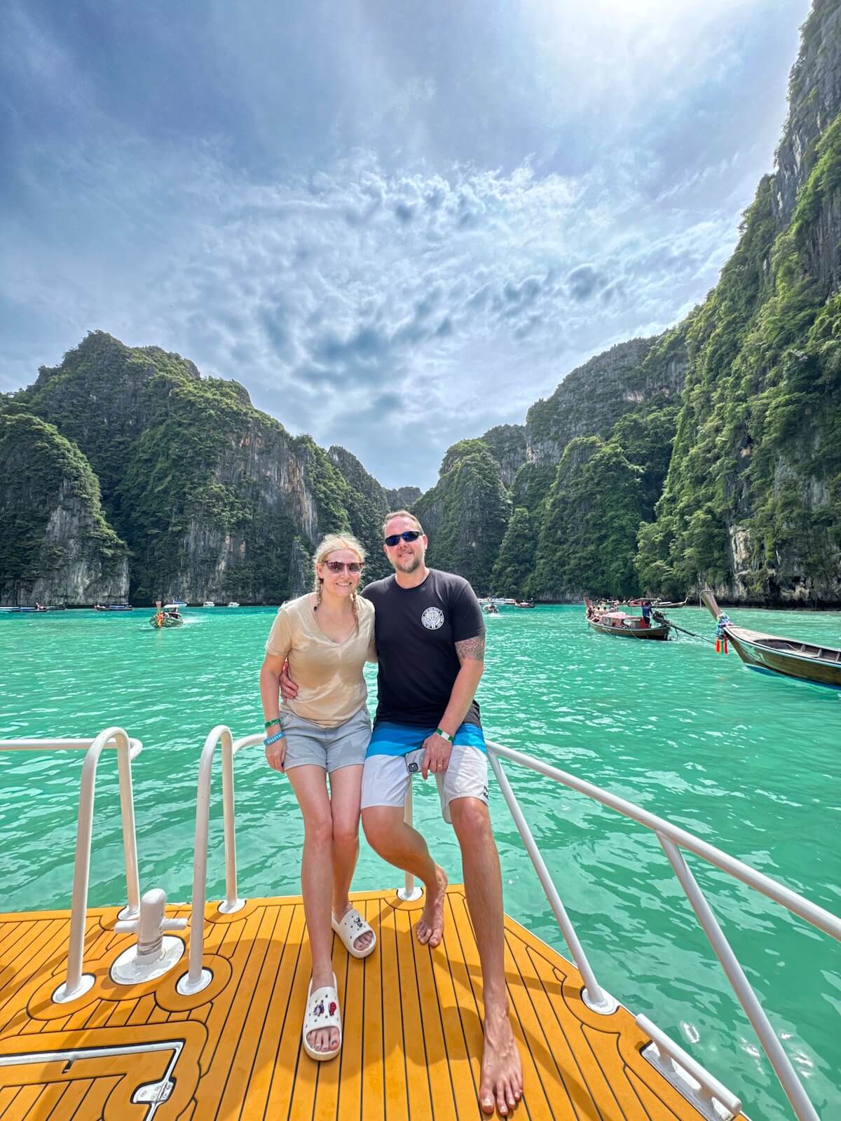 couple having a photo on ship hull in pileh lagoon.