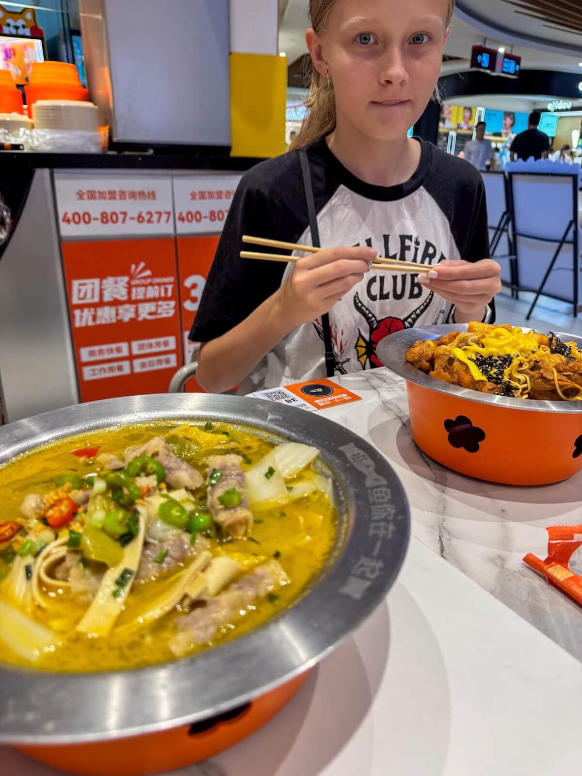 teenager eating food in china.