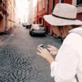 woman using phone to navigate while travelling.
